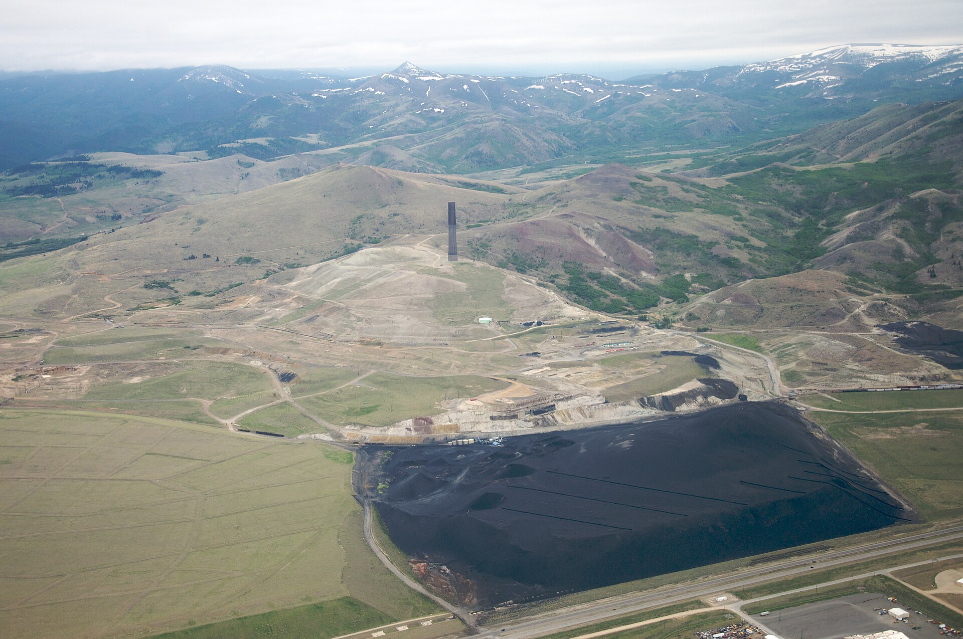 The Anaconda Smelter Stack (1919) with copper slag in the foreground, Anaconda, Montana
