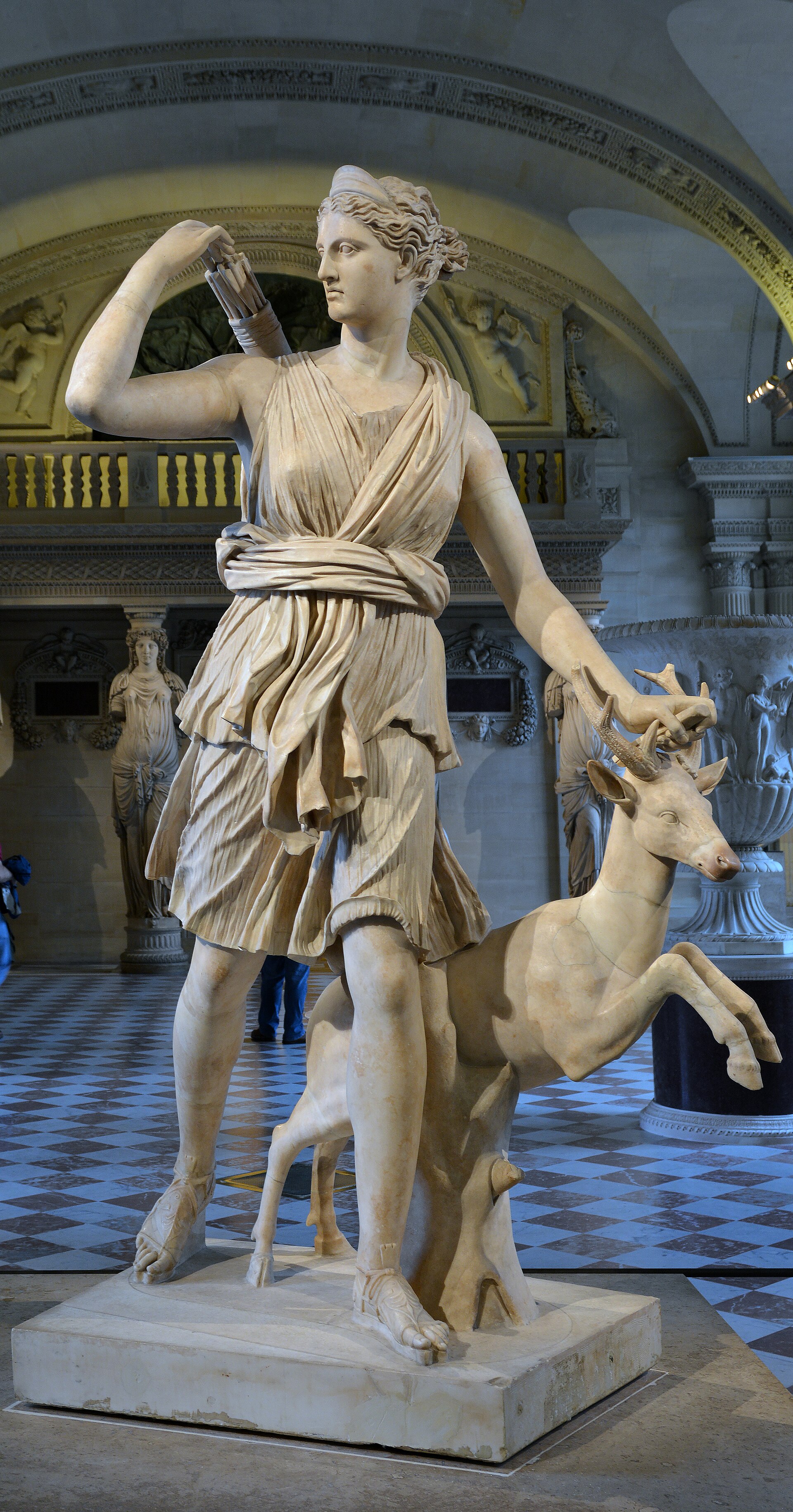 The Diana of Versailles, a Roman marble copy (1st–2nd c. CE) of a lost Greek bronze attributed to Leochares, depicting Artemis as huntress with a stag, in the Louvre