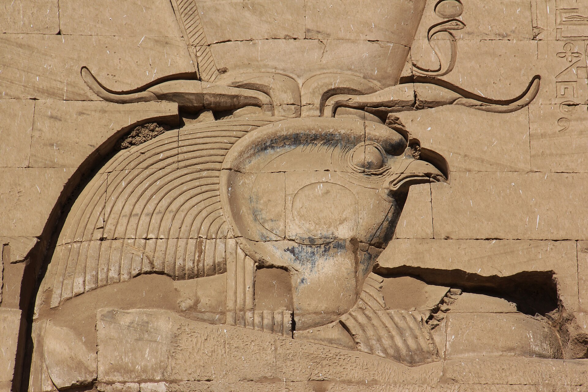 Carved relief on the pylon of the Temple of Edfu depicting the falcon god Horus