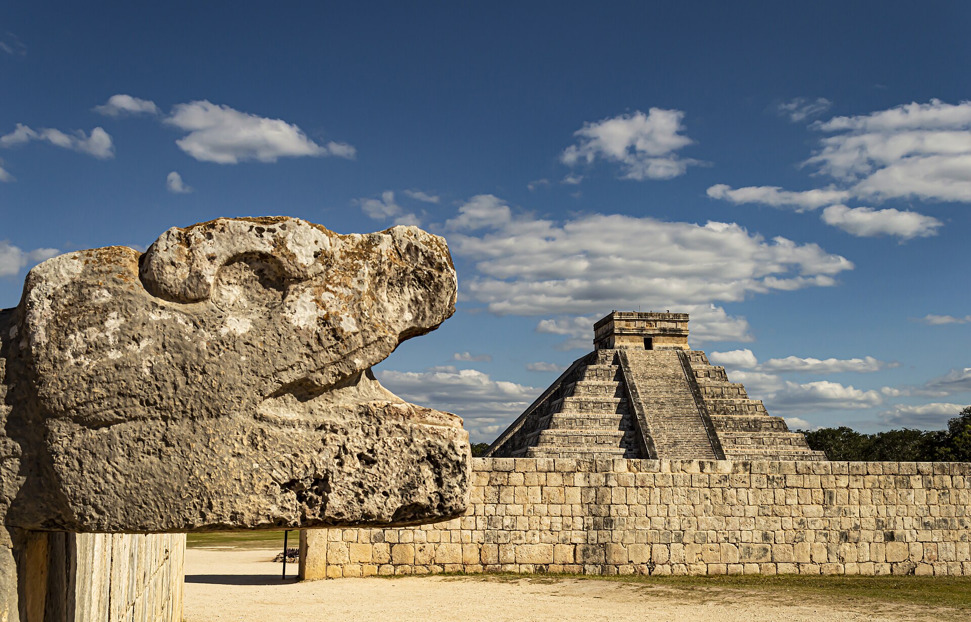 Carved stone serpent head of Kukulkán at the base of El Castillo pyramid, Chichen Itza, Yucatán; c. 9th–12th century CE
