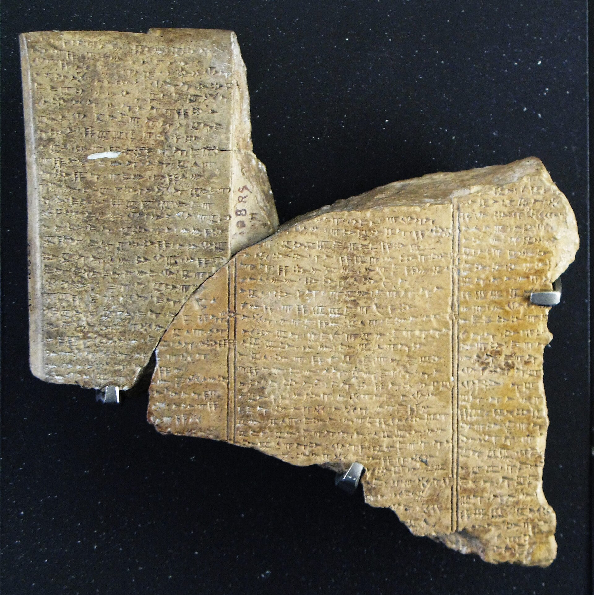 Cuneiform clay tablets from Ugarit (Louvre AO16641-AO16642) recording the Baal Cycle, in which Mot, Canaanite god of death, slays Baal.