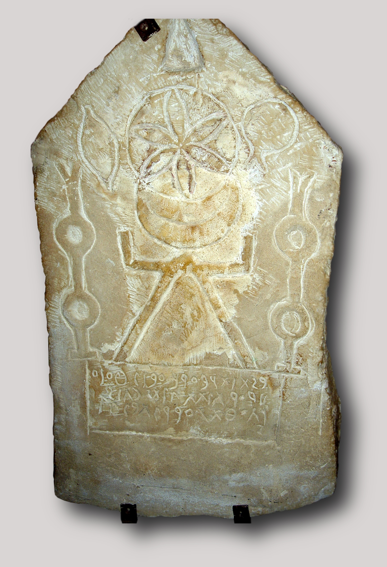 Stone stele depicting the Punic goddess Tanit, ancient Carthaginian artifact, Bardo National Museum, Tunis.