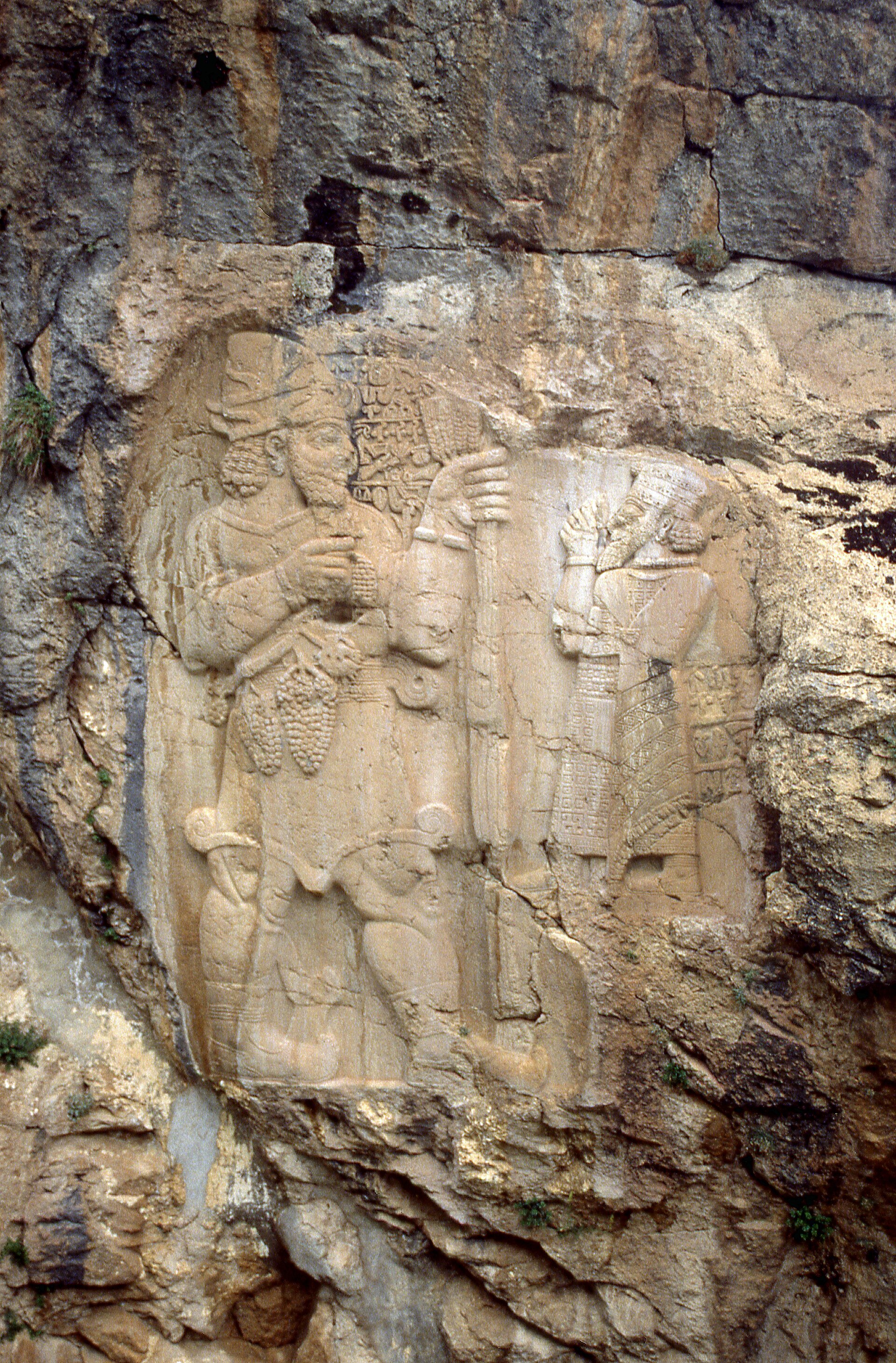 Ivriz rock relief showing the Luwian storm god Tarhunz holding grapes and grain before King Warpalawas