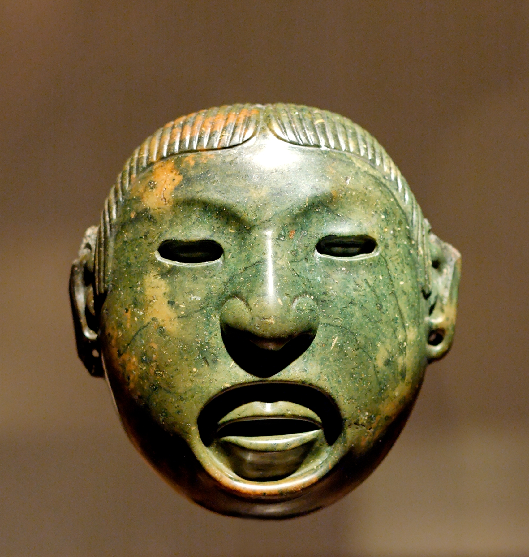 Pendant-mask associated with rituals of Xipe Totec, Aztec god of agriculture and renewal, Valley of Mexico, Louvre Museum.