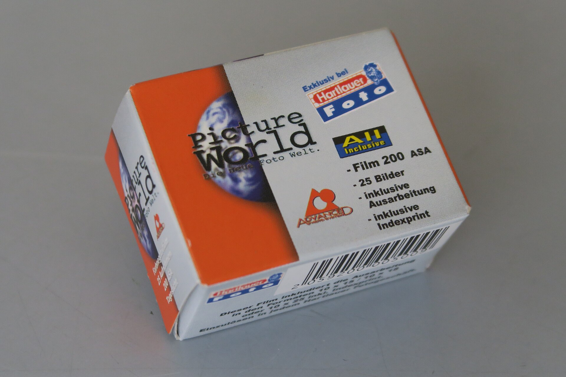 Several APS (IX240) film cartridges in their small cylindrical casings.