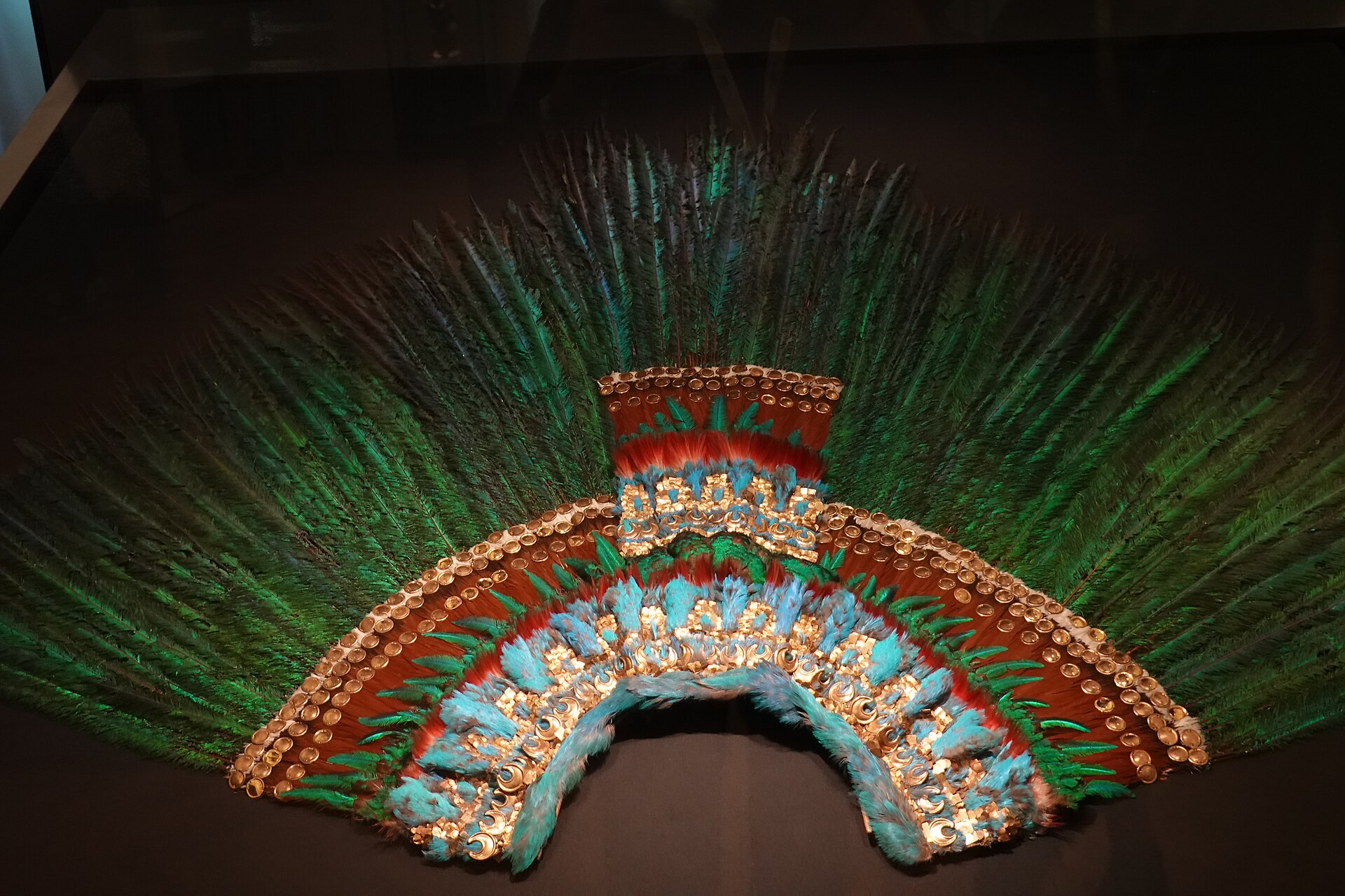 The feather headdress attributed to Moctezuma II, c. 1515, built from over 450 resplendent quetzal tail feathers and feather mosaic, held at the Weltmuseum Wien, Vienna