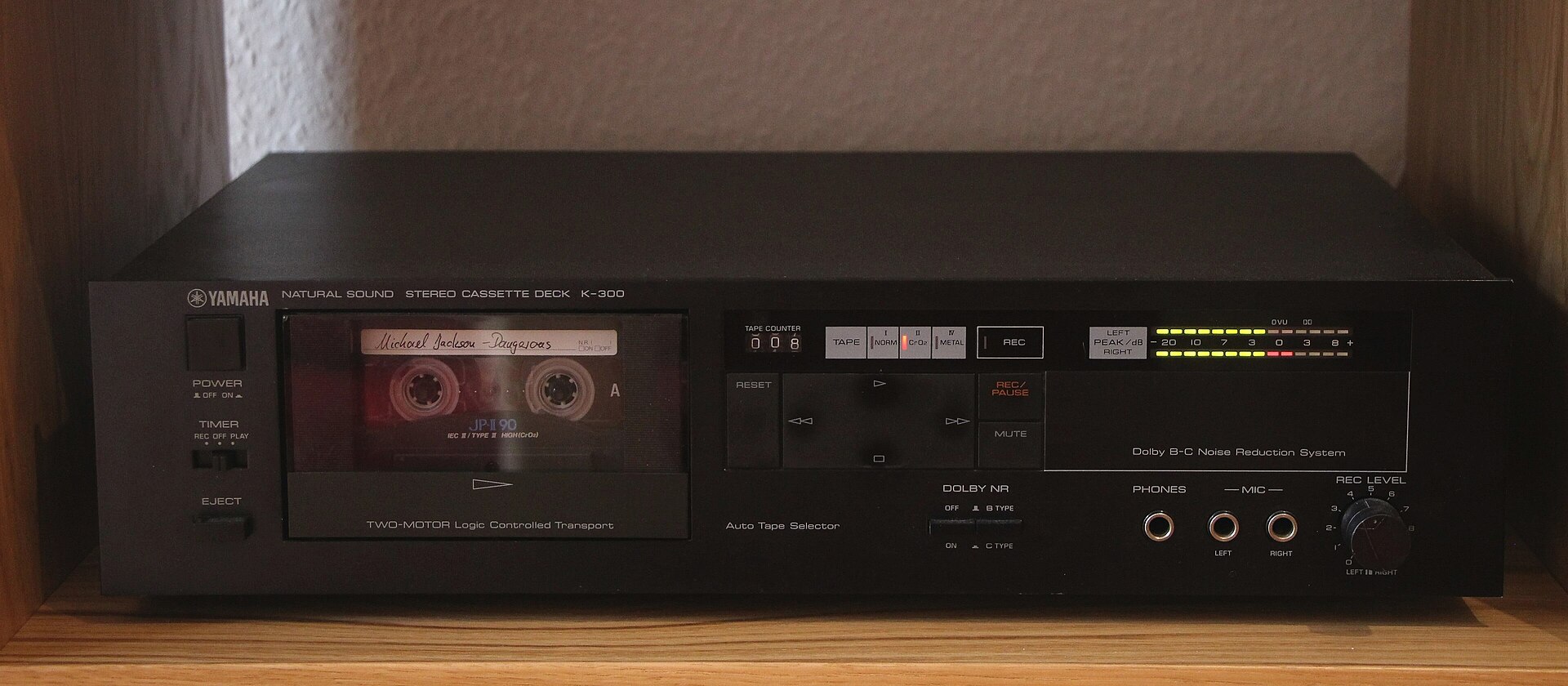 A Yamaha K-300 cassette deck from 1983 with a cassette loaded