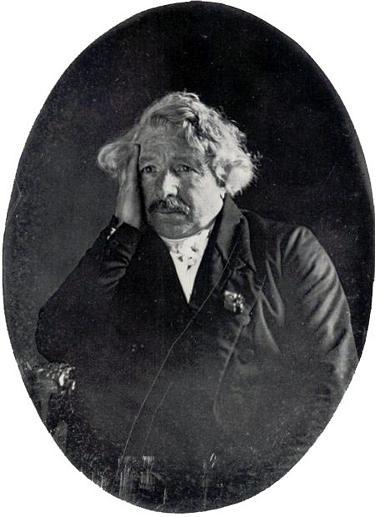 A daguerreotype portrait of Louis Daguerre, inventor of the process, on a silvered plate.