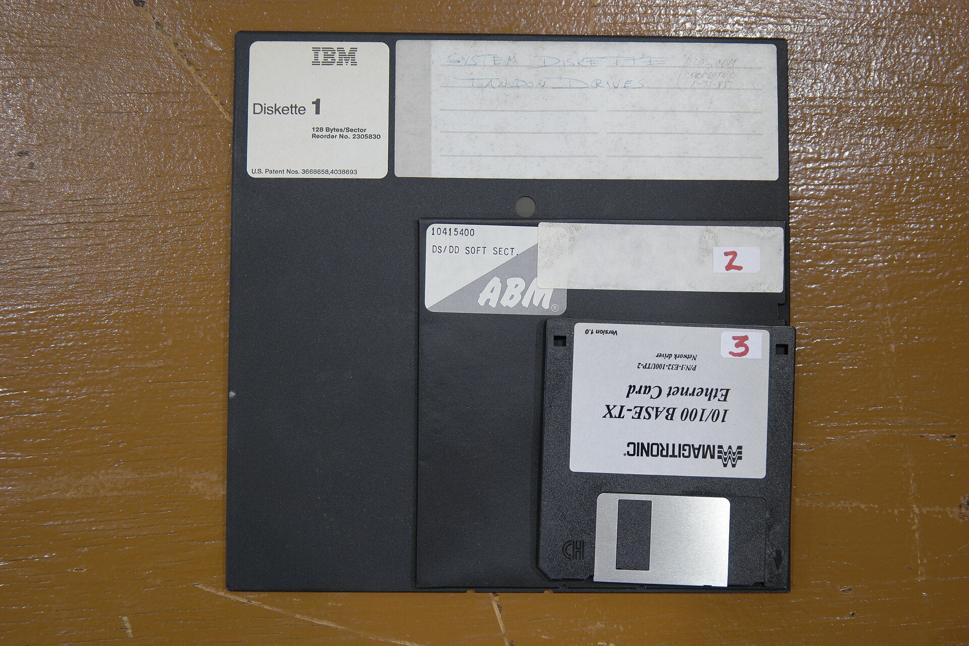 8-inch, 5.25-inch and 3.5-inch floppy disks side by side showing the format evolution