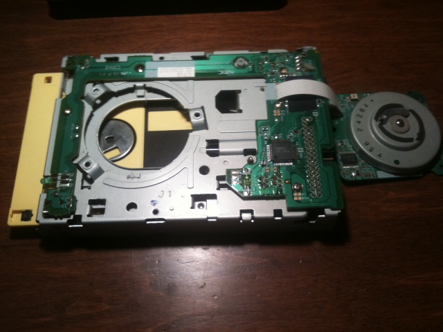 A 3.5-inch floppy disk being inserted into a computer's disk drive
