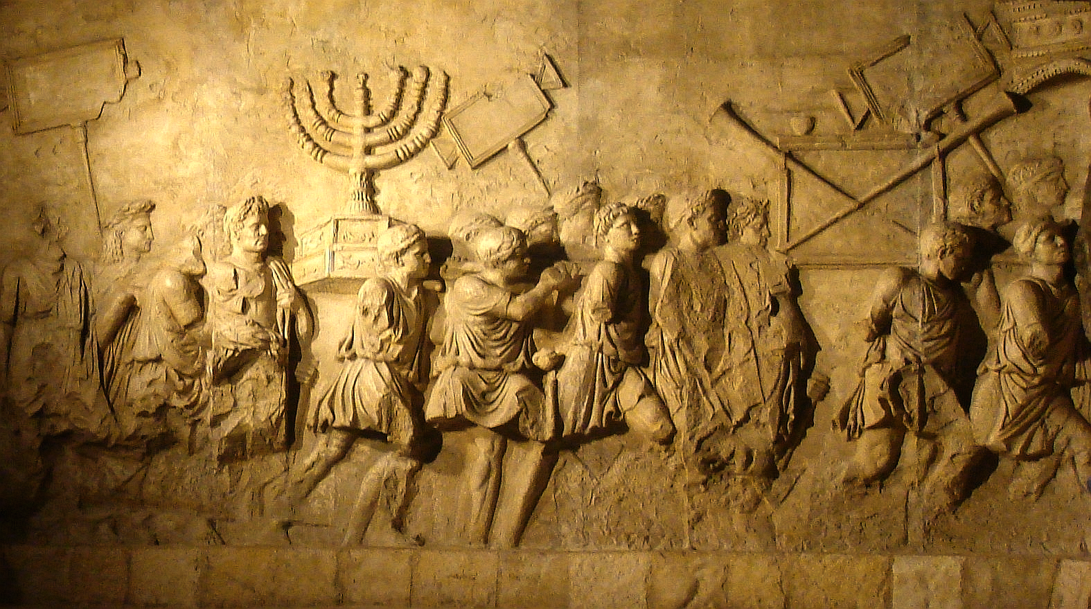 Relief from the Arch of Titus, Rome, depicting the Temple menorah being carried off after the destruction of Jerusalem in 70 CE