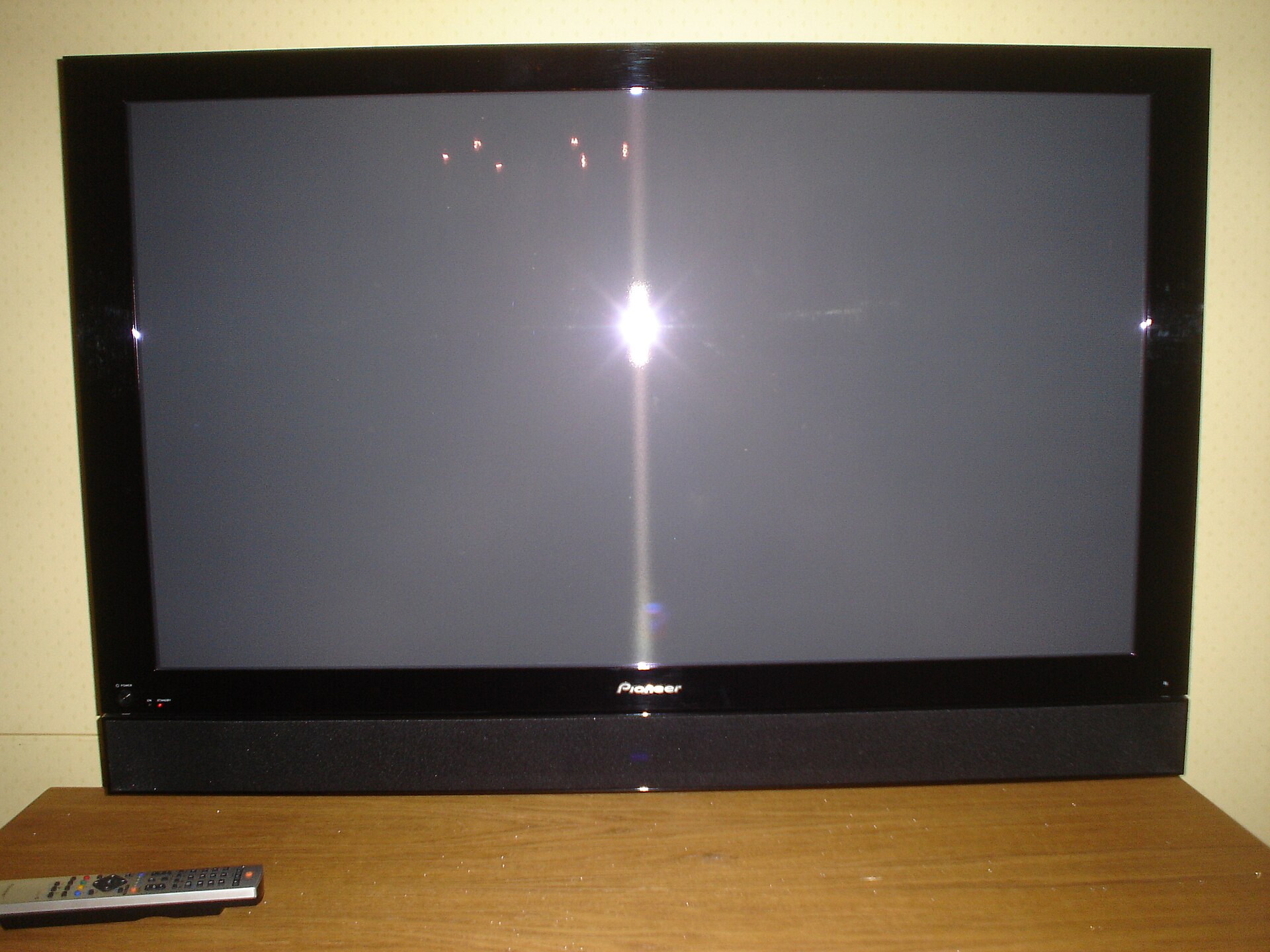 A Pioneer plasma flat-panel television on a stand.