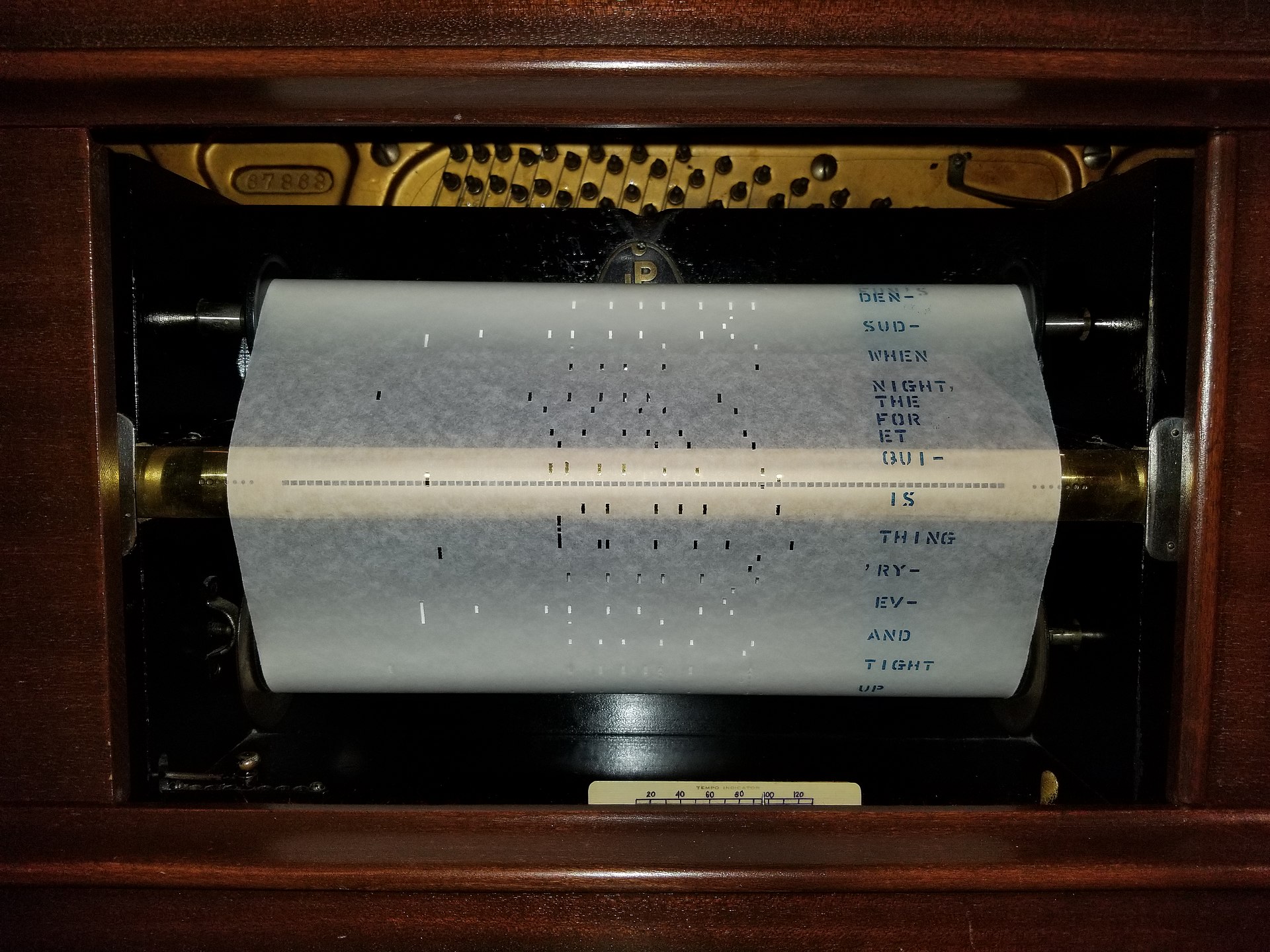 A perforated paper player piano roll