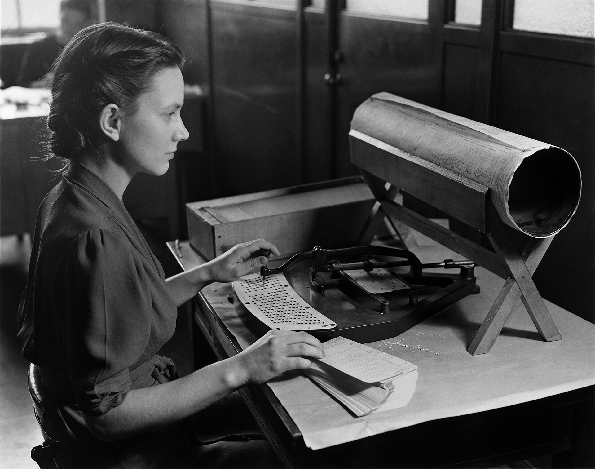 A woman operating a Hollerith pantograph card punch for the 1940 US census, circa 1940