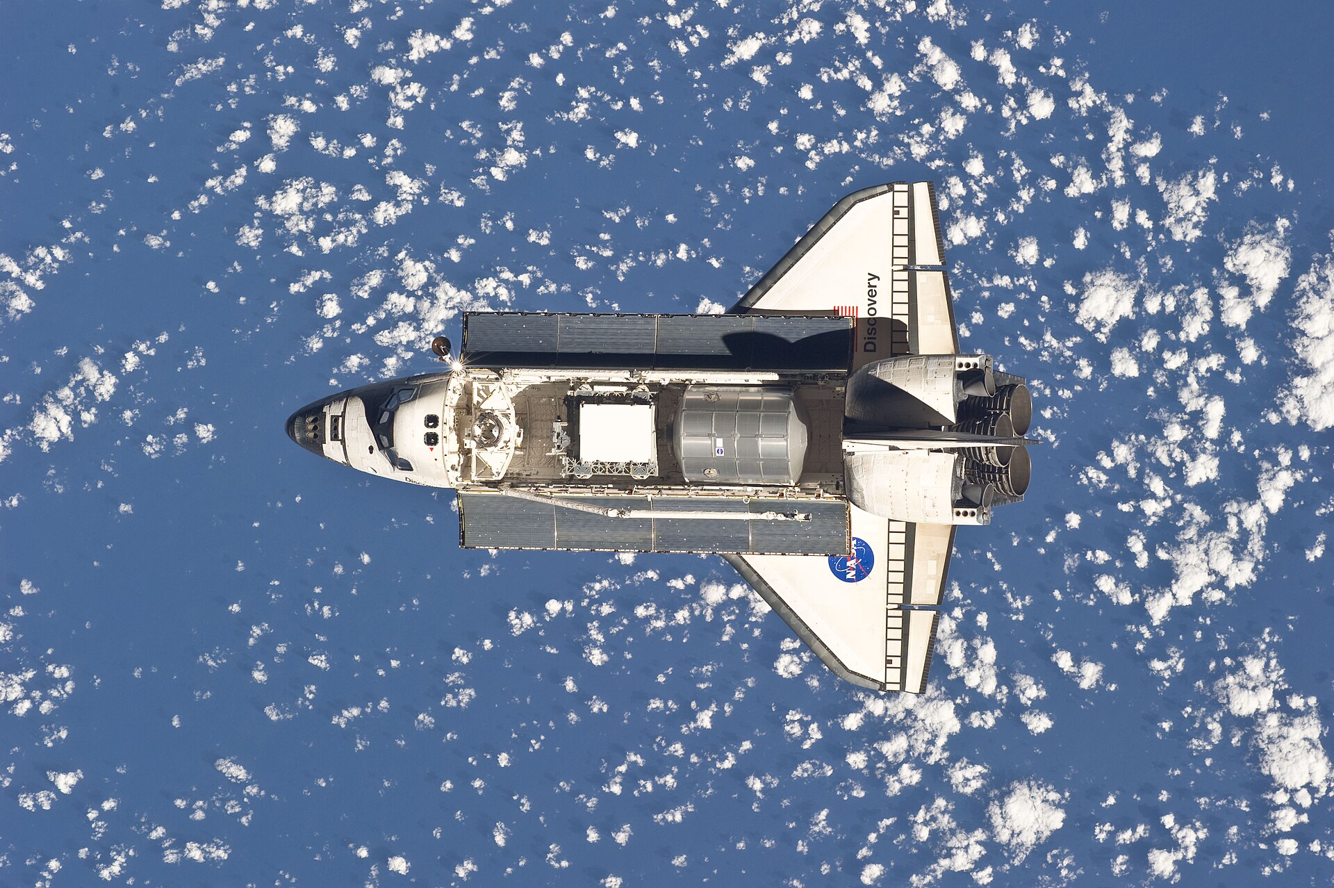 Space Shuttle Discovery approaching the International Space Station during STS-133