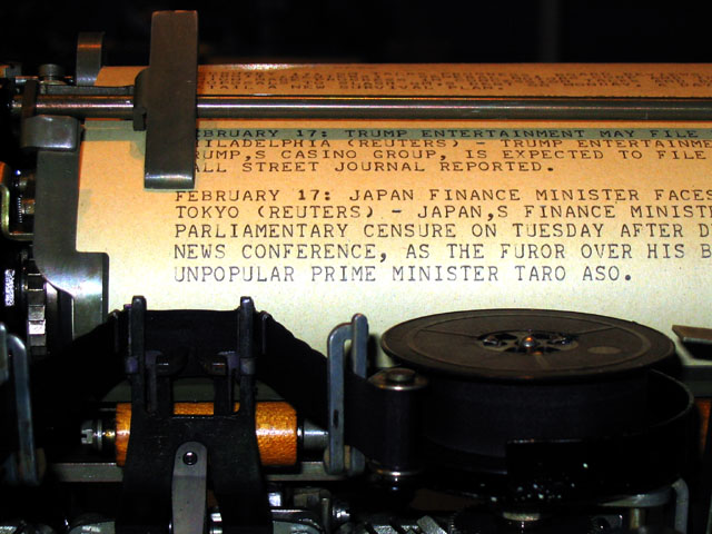 A refurbished Teletype Model 15, built in the 1940s, printing a Reuters news feed