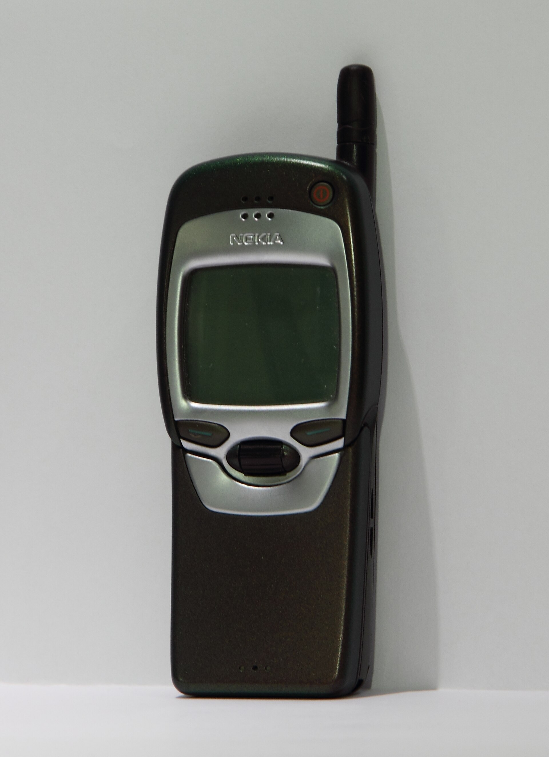 A Nokia 7110, one of the first WAP-enabled mobile phones, with its spring-loaded cover.