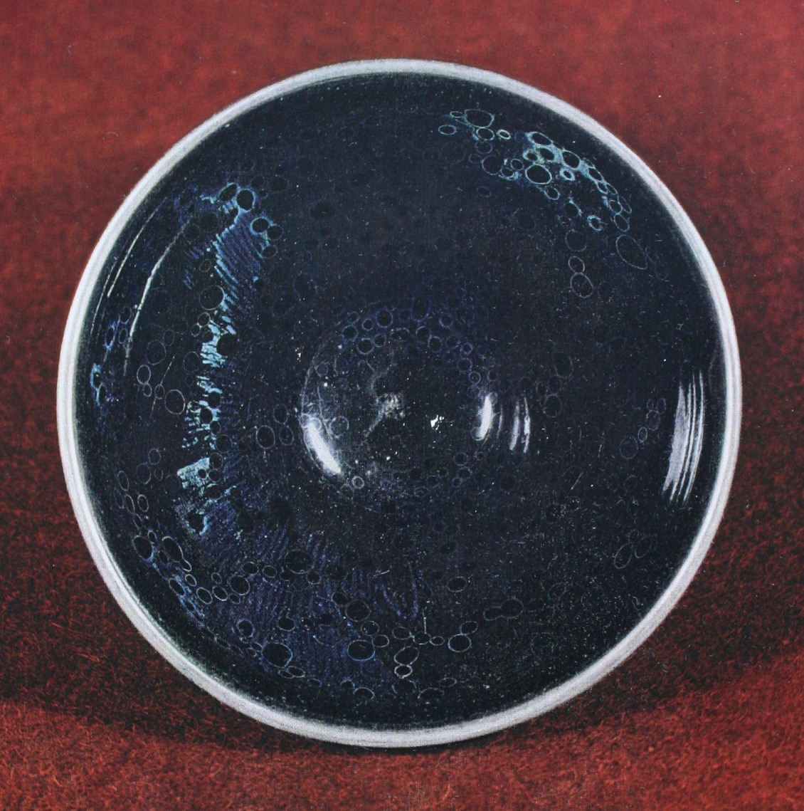 A yōhen tenmoku tea bowl from the Fujita Museum, Osaka — one of only three known examples, all designated National Treasures of Japan