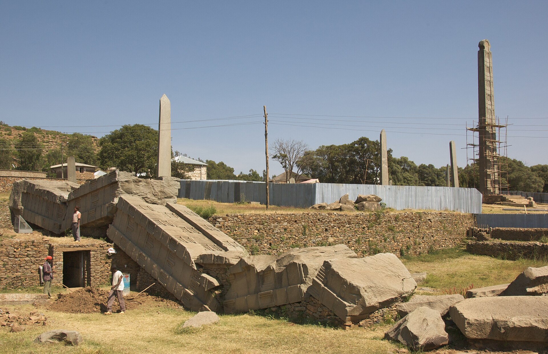 The Northern Stelae Park at Aksum, Ethiopia, with the standing carved granite stela of King Ezana on the right and the shattered Great Obelisk on the left