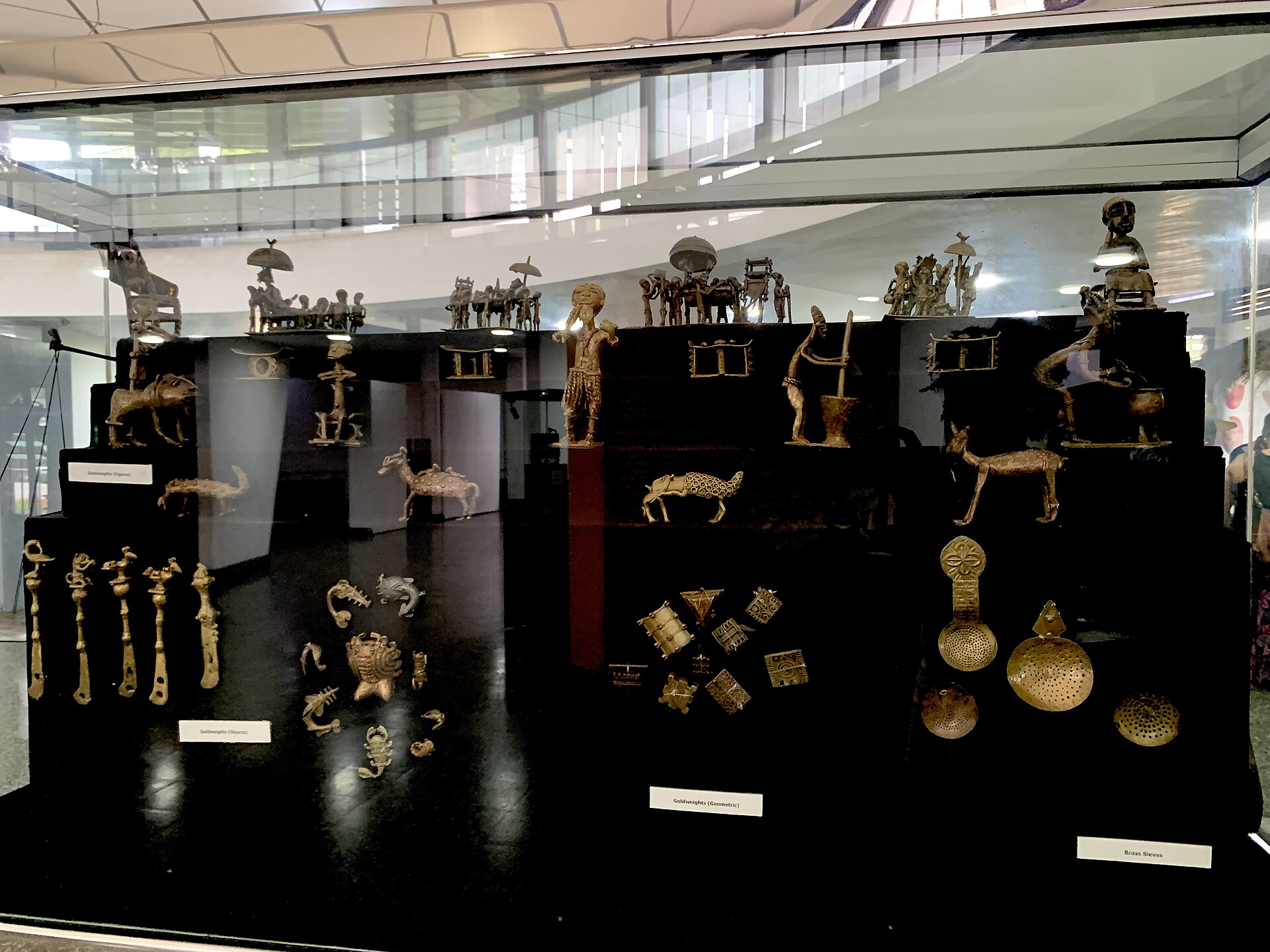 Akan brass goldweights cast in figurative shapes, used by the Asante to measure gold dust