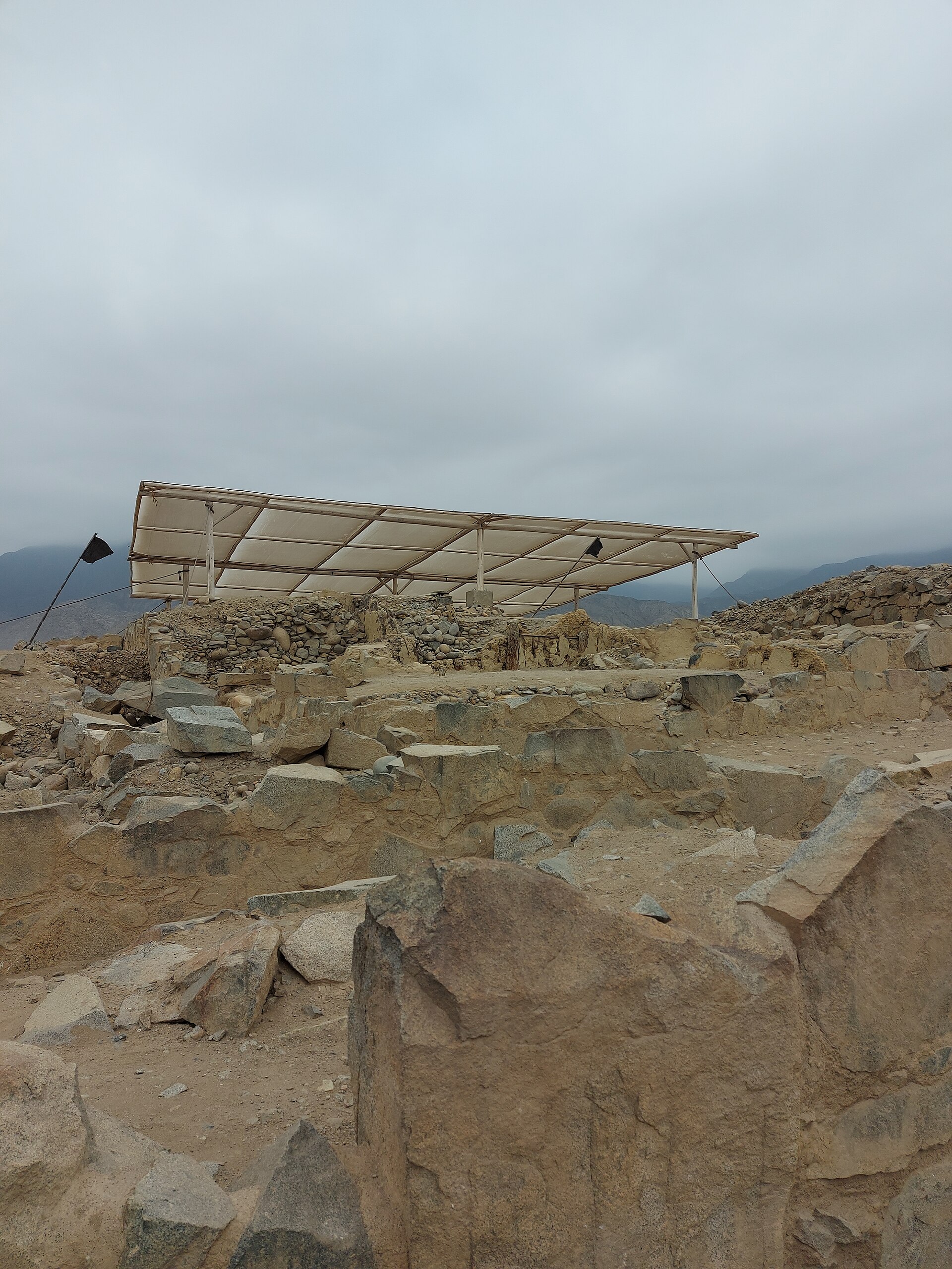 Shicras — woven reed bags filled with stone — exposed in the foundation walls of a pyramid at Caral