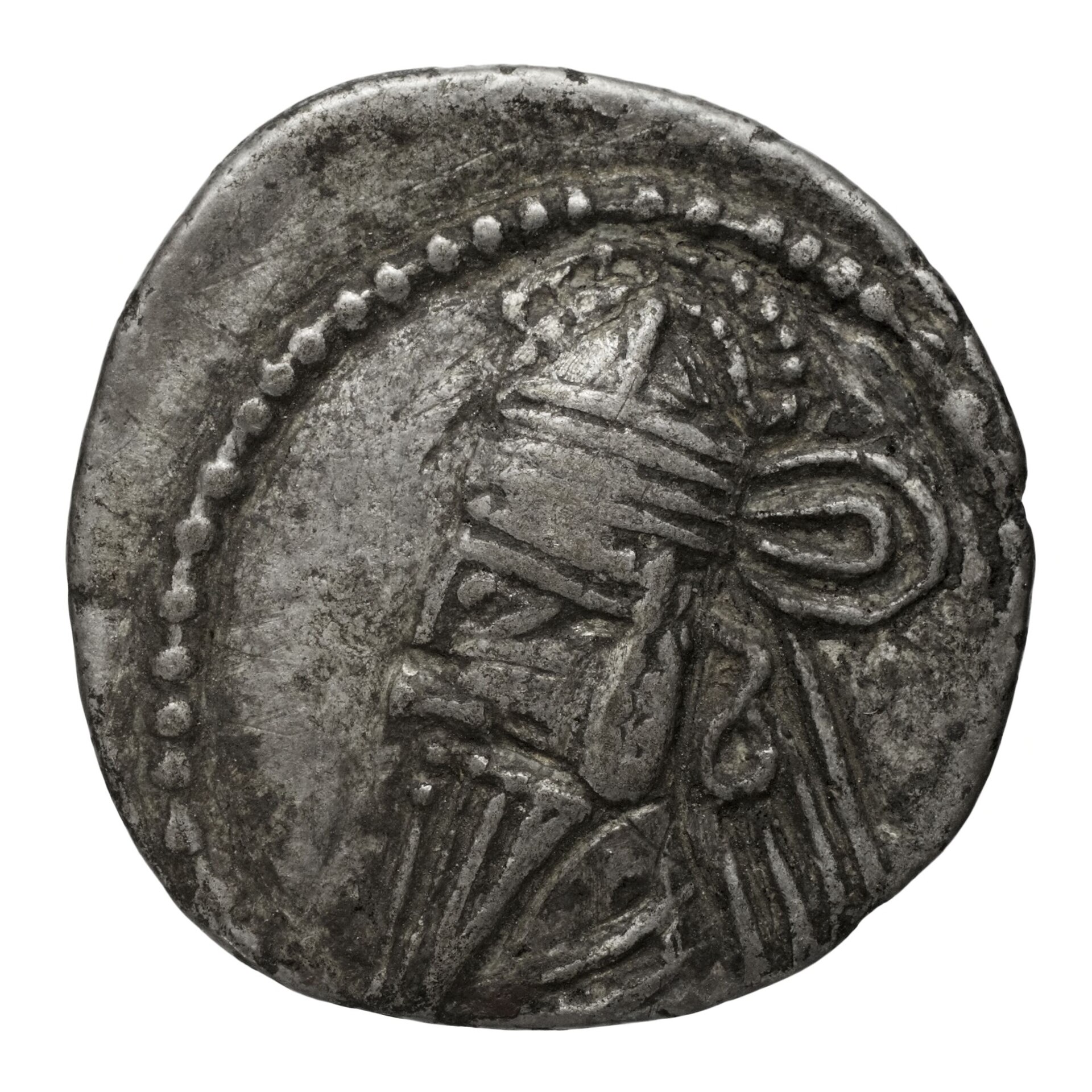 A silver Parthian drachm; the obverse shows a bearded diademed king, the standard imperial coinage of the Arsacid dynasty