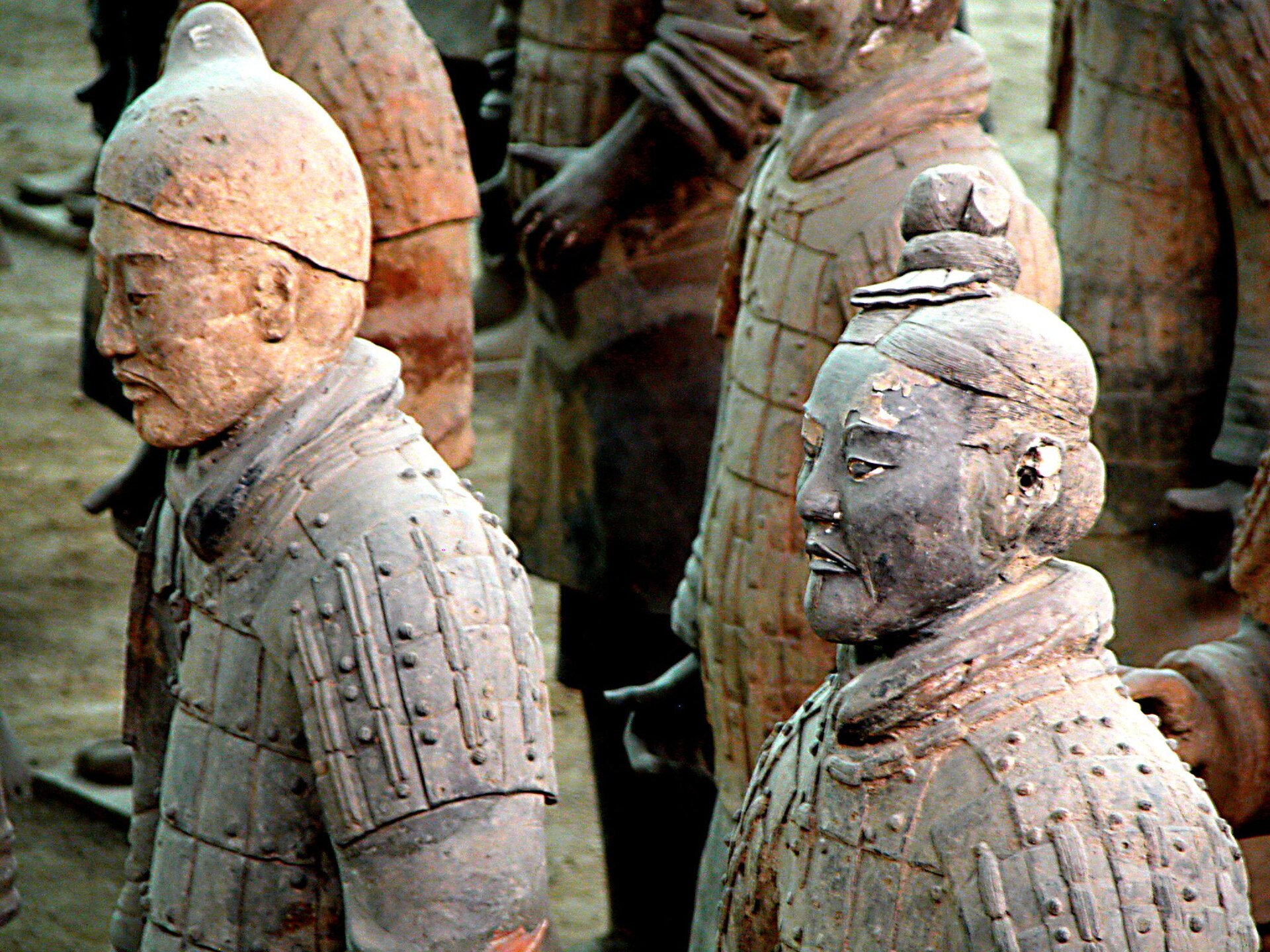 Close-up of a single terracotta warrior's face, showing the individually modelled features of the Qin tomb figures