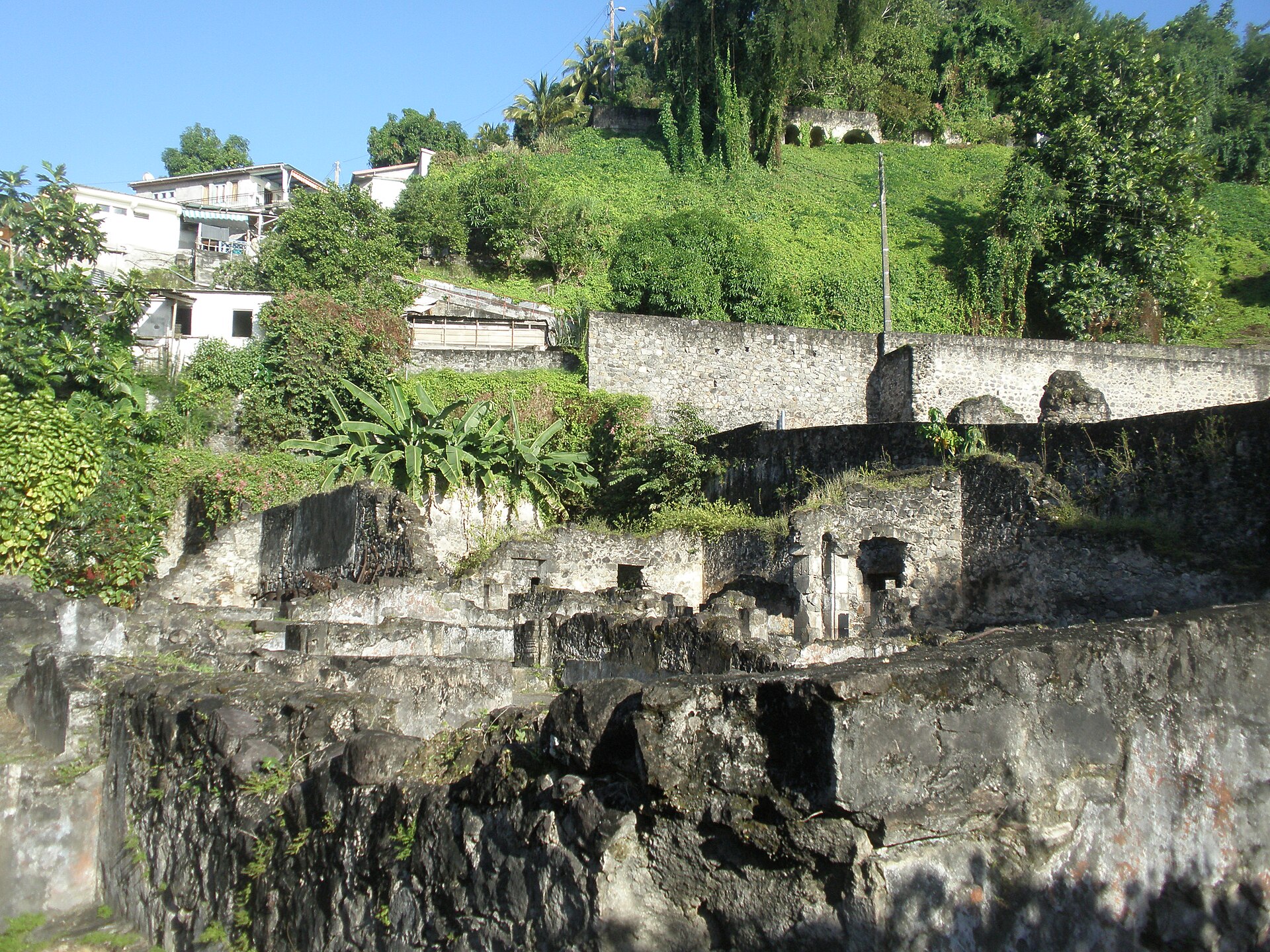 The roofless stone ruins of the prison at Saint-Pierre, Martinique, destroyed by Mont Pelée in 1902.