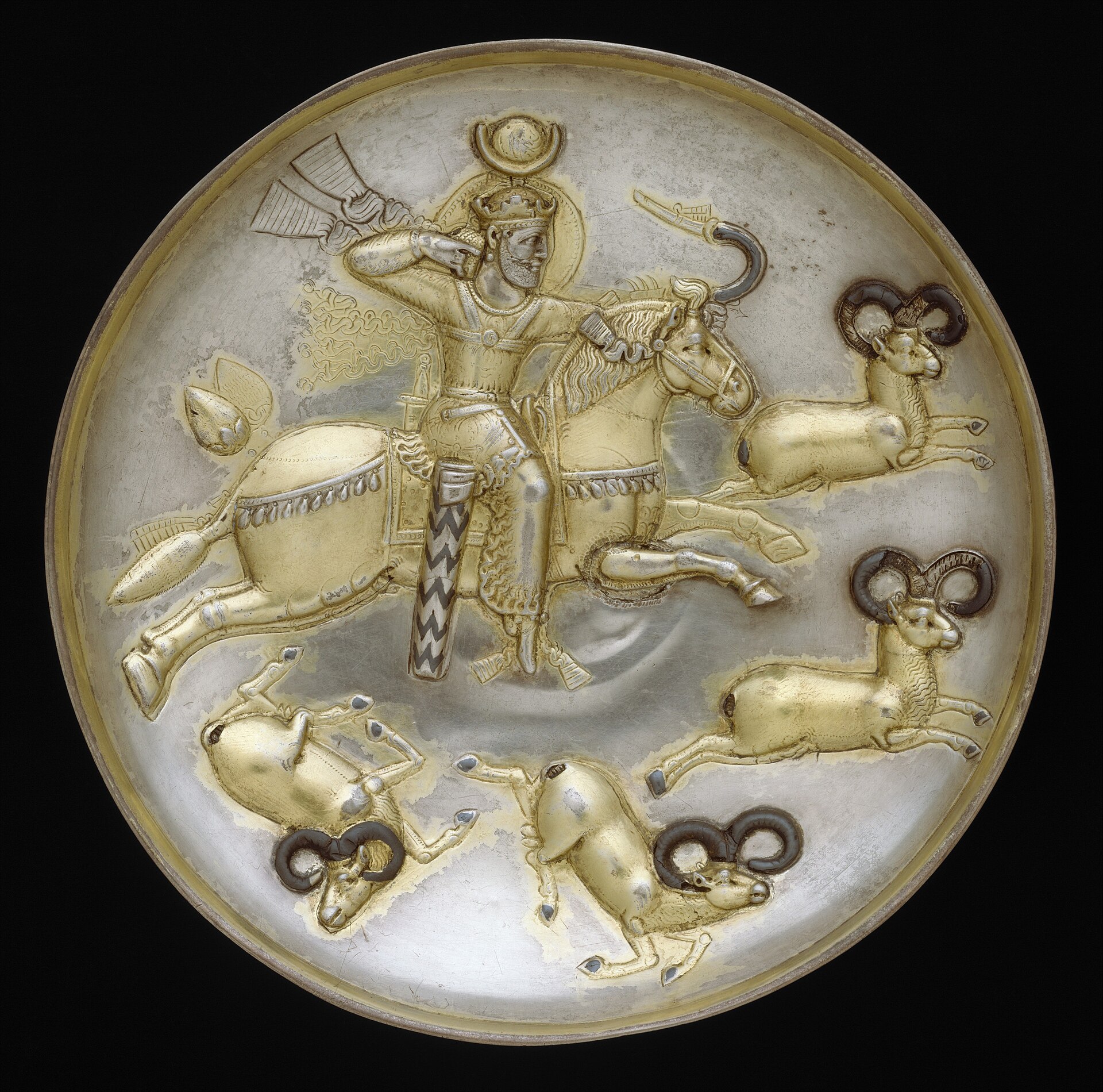Sasanian gilded silver plate showing a king hunting rams