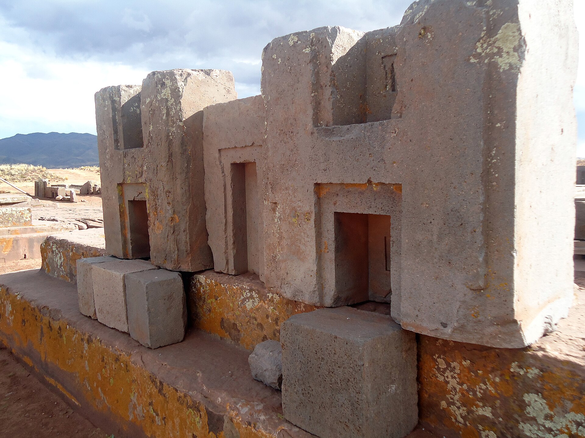 Precision-cut andesite blocks at Pumapunku, Tiwanaku, trimmed into interlocking H-shaped profiles with sharp right angles