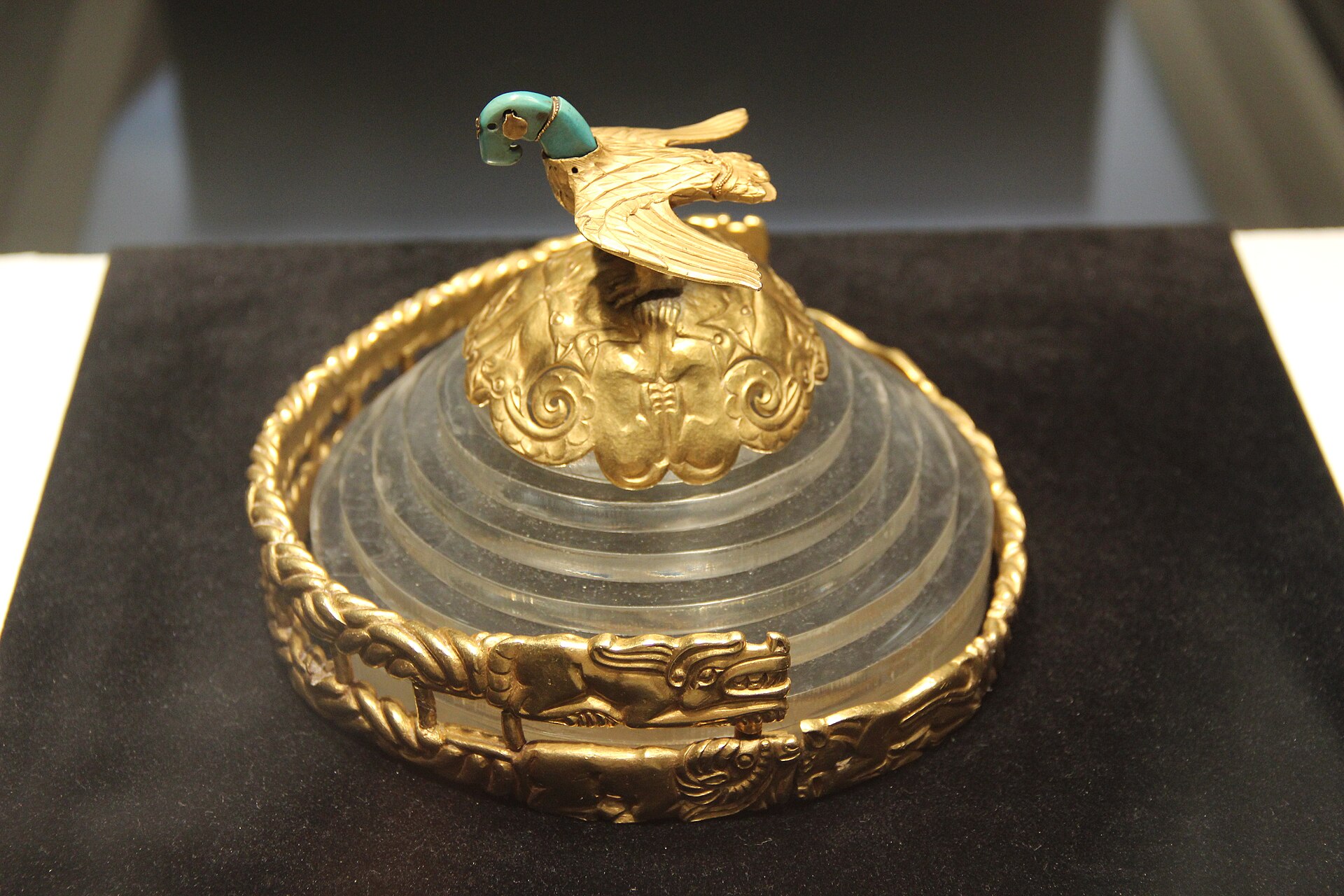 A Xiongnu gold headdress topped with an eagle, animal-style steppe goldwork, in a museum collection